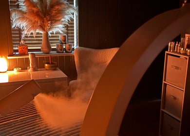 Relaxing ambiance at Sacred Roots Limited, Guernsey, Vale, GG. Cozy room with a soft glow and wellness products.