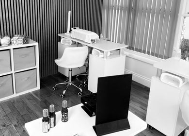 A calming nail studio at Sacred Roots Limited in Guernsey, Vale, GG, featuring modern furniture and decor.