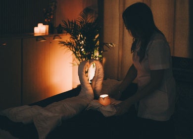 Tranquil massage setup with candles at Glam and Glow Beauty Lab, Hockley Heath, England, GB.