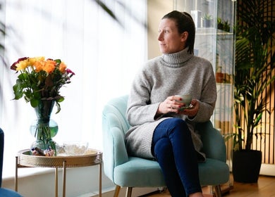 Relaxing woman enjoying a cup of tea at Glam and Glow Beauty Lab, Hockley Heath, England, GB.