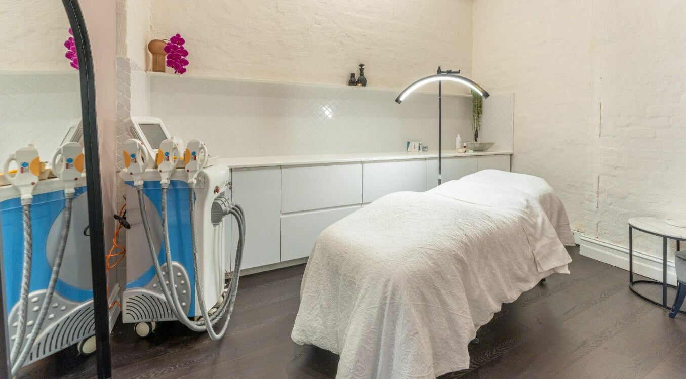 Chic treatment room at Skin by KAMÉ, Melbourne, Victoria, AU with modern equipment and cozy ambiance.