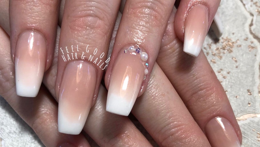 Elegant acrylic nails at Feel Good Nails in Benoni, Gauteng, ZA with subtle gradient and gem accents.
