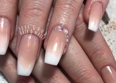 Elegant acrylic nails at Feel Good Nails in Benoni, Gauteng, ZA with subtle gradient and gem accents.
