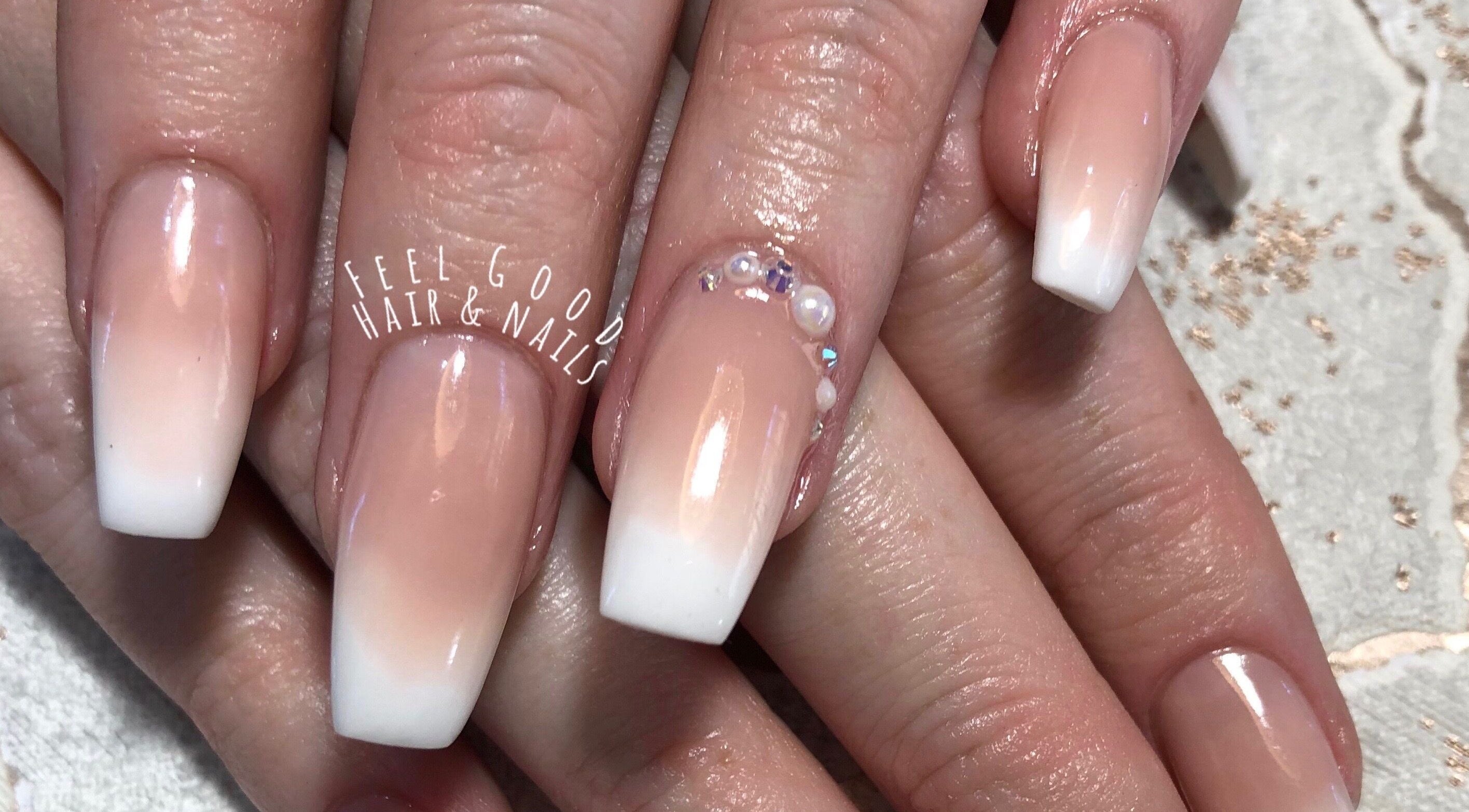 Elegant acrylic nails at Feel Good Nails in Benoni, Gauteng, ZA with subtle gradient and gem accents.