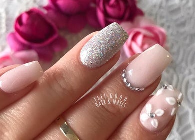 Elegant nail art with glitter and floral designs at Feel Good Nails, Benoni, Gauteng, ZA.