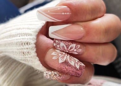 Elegant nail art with floral and glitter designs at Feel Good Nails, Benoni, Gauteng, ZA.
