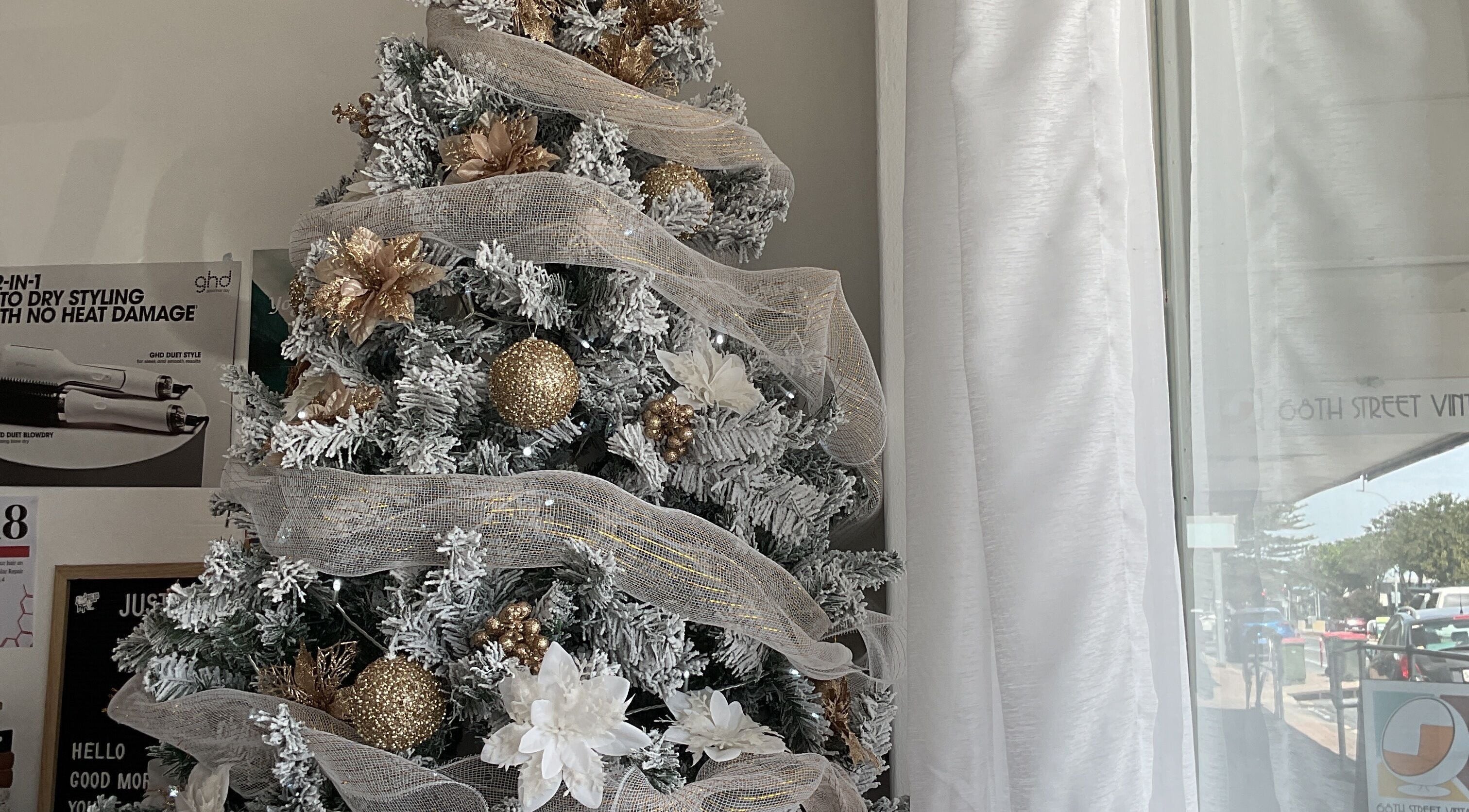 Christmas tree in Hair Lounge at CBR, Christies Beach, South Australia, AU adorned with gold and white decor.