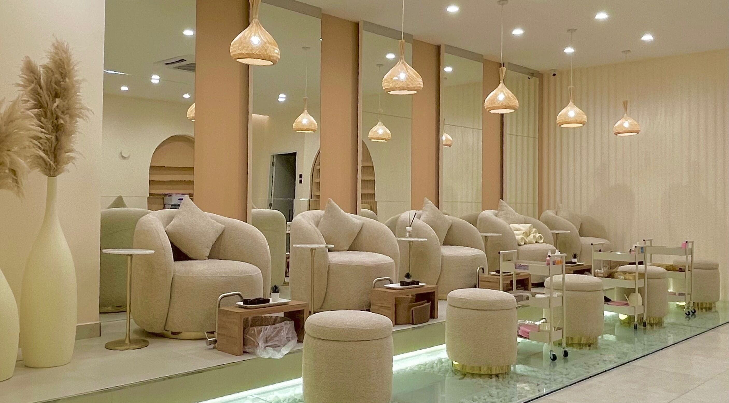 Elegant seating area at O'mbre in Muscat, Muscat Governorate, OM, showcasing neutral tones and modern decor.