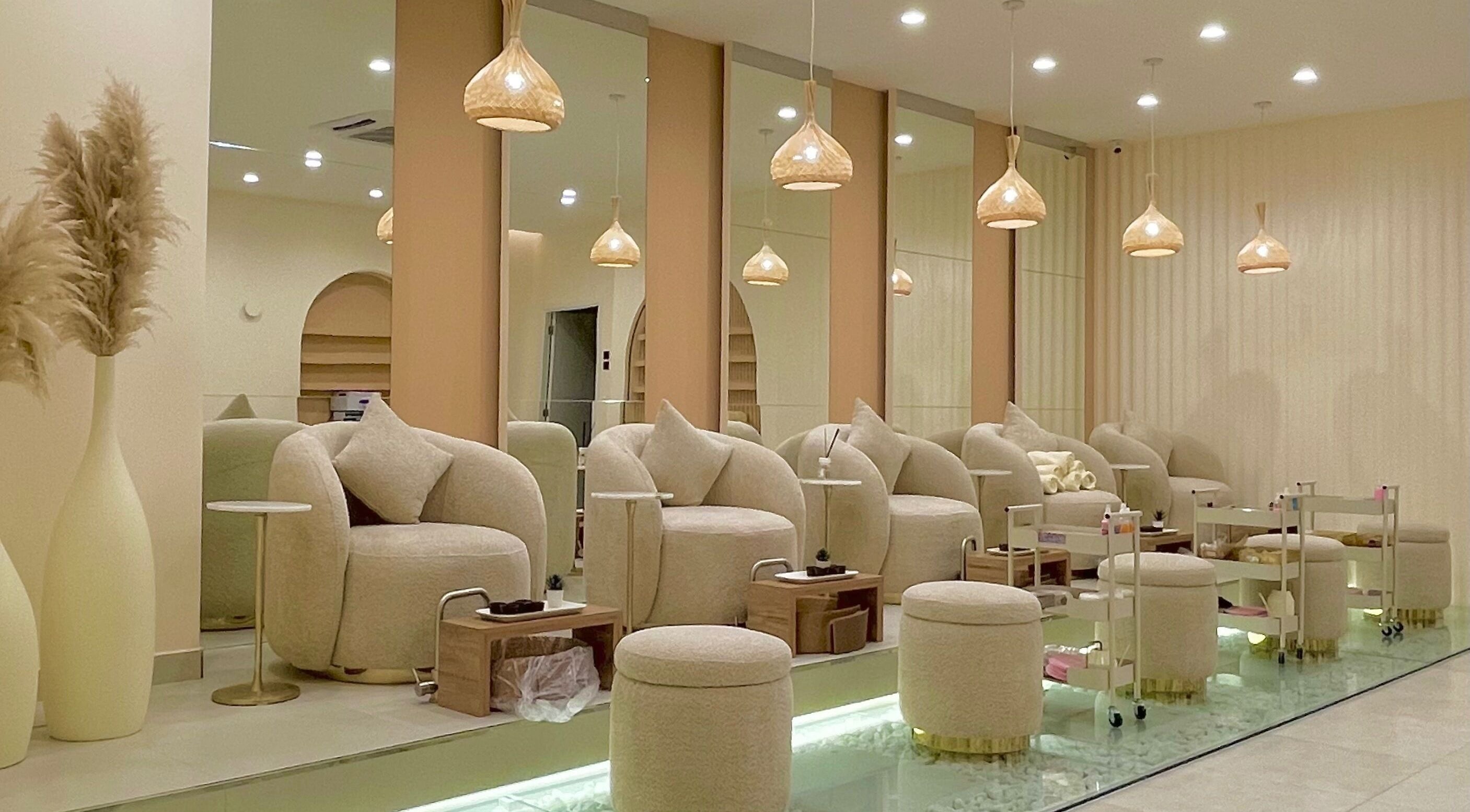 Elegant seating area at O'mbre in Muscat, Muscat Governorate, OM, showcasing neutral tones and modern decor.