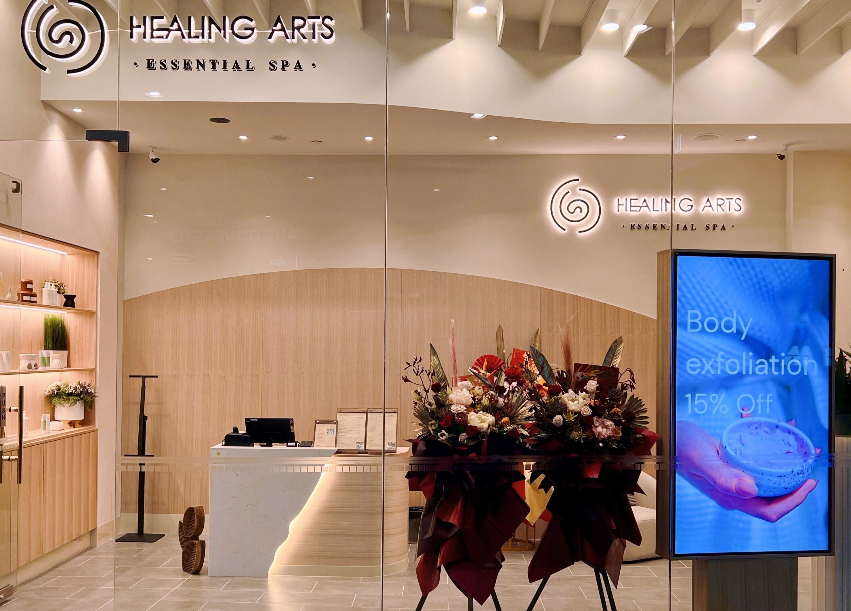 Entrance of Healing Arts Essential Spa in Melbourne, Victoria, AU showcasing elegant decor and promotional display.