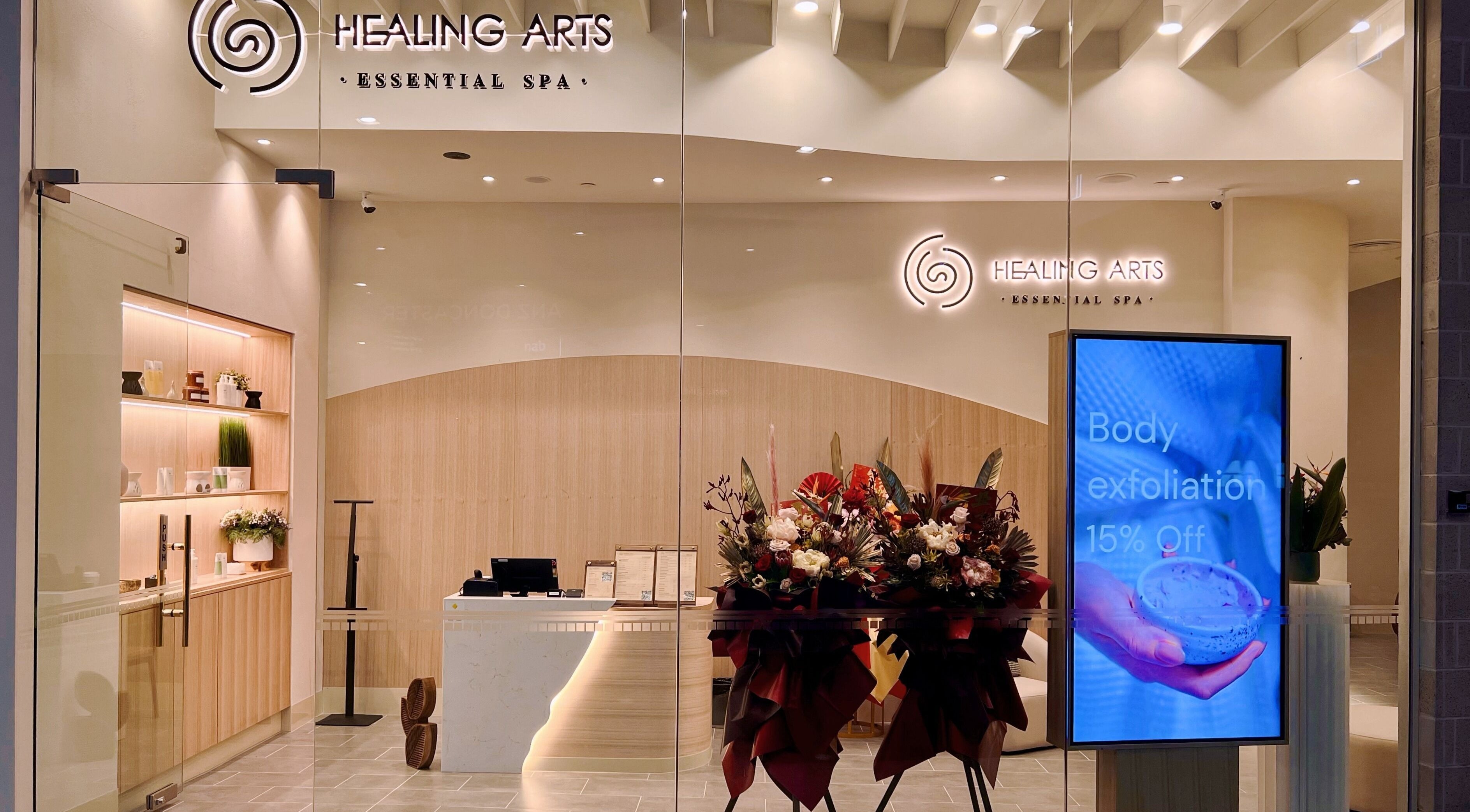 Entrance of Healing Arts Essential Spa in Melbourne, Victoria, AU showcasing elegant decor and promotional display.