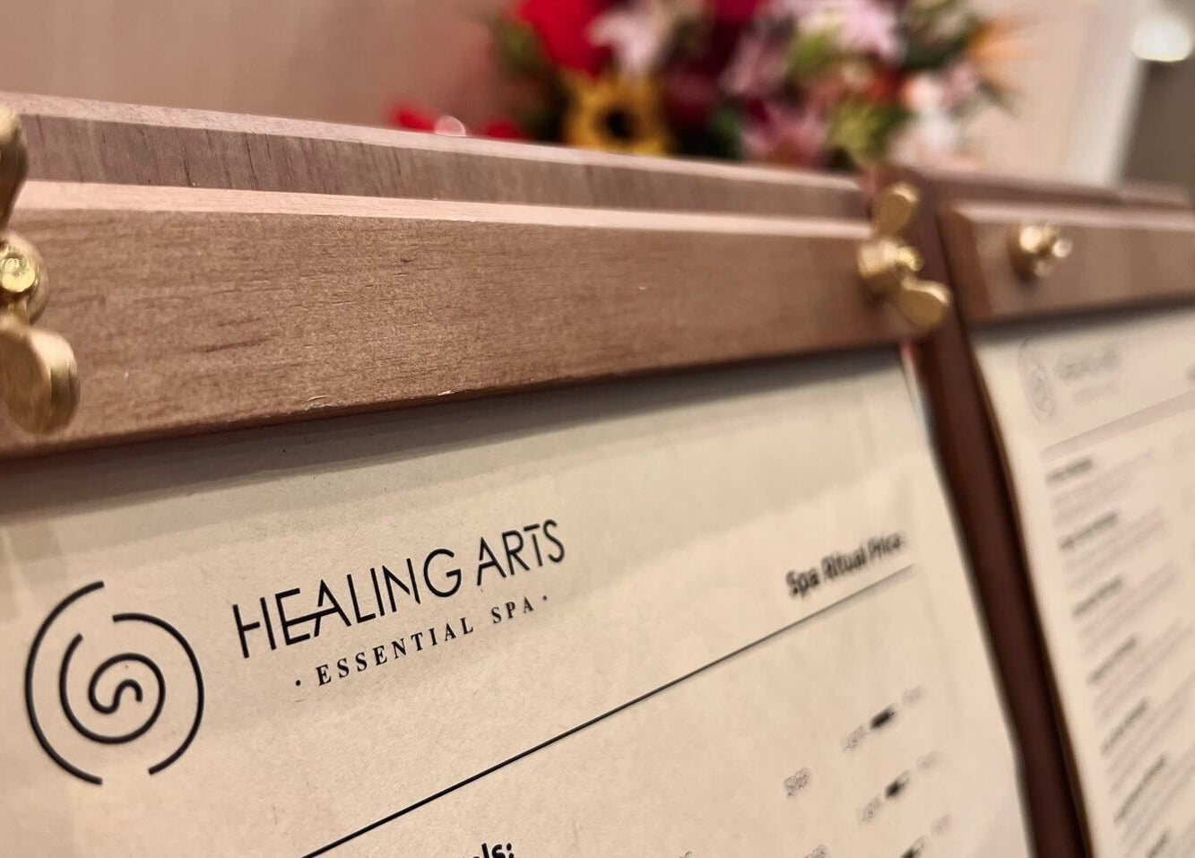 Healing Arts Essential Spa price list in Melbourne, Victoria, AU with elegant wooden frames.