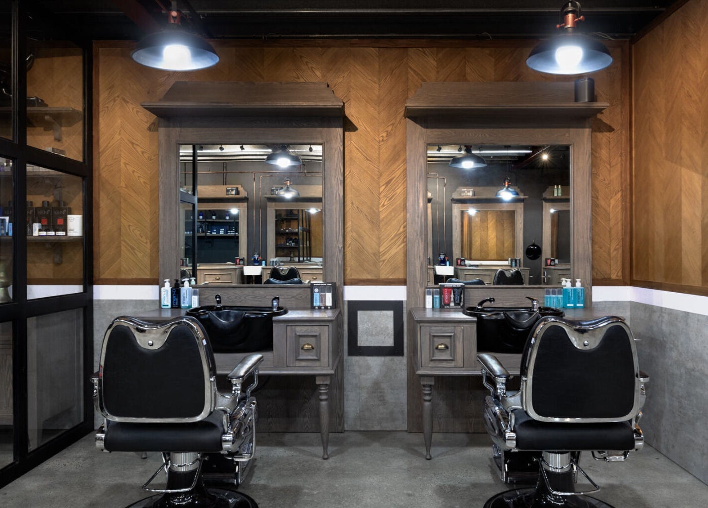 Stylish interior of Davilia Barbershop Karrinyup, featuring sleek chairs and mirrors in Karrinyup, Western Australia, AU.