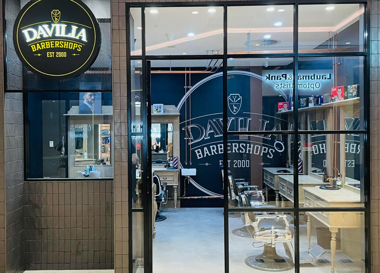 Davilia Barbershop Karrinyup's sleek interior, featuring modern chairs and elegant design in Karrinyup, Western Australia, AU.