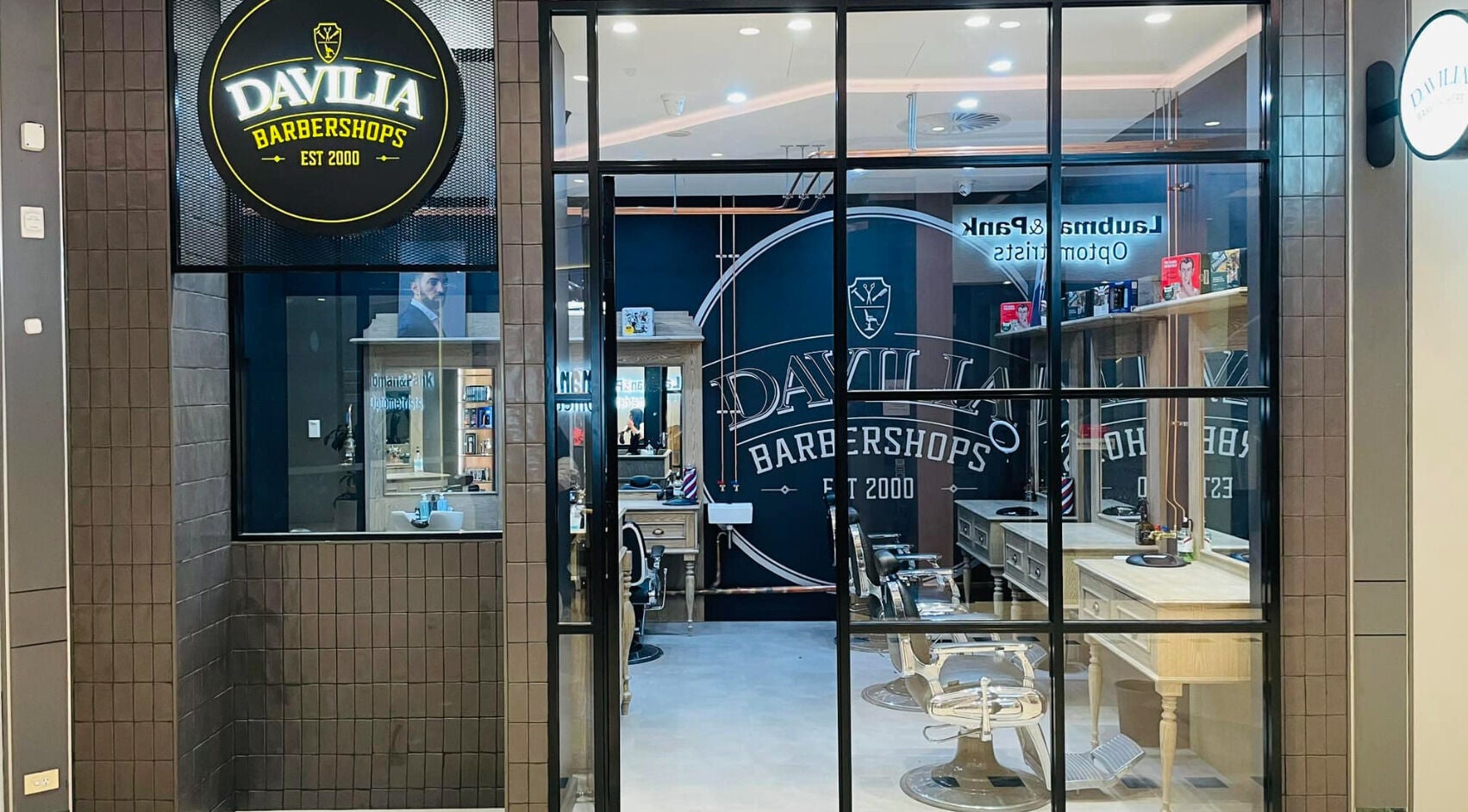 Davilia Barbershop Karrinyup's sleek interior, featuring modern chairs and elegant design in Karrinyup, Western Australia, AU.
