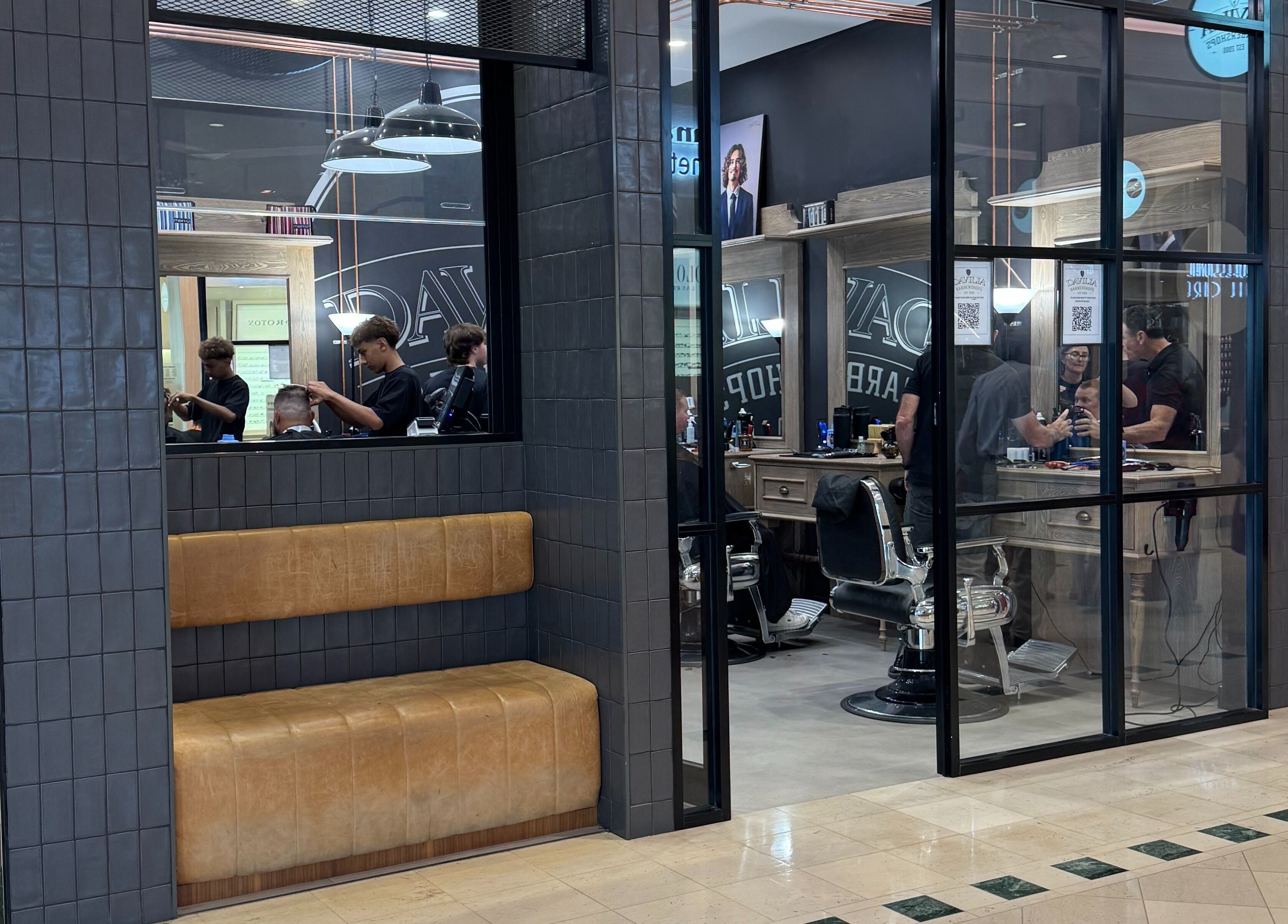 Inside view of Davilia Barbershop Karrinyup, showcasing stylish decor and cozy seating in Karrinyup, Western Australia.