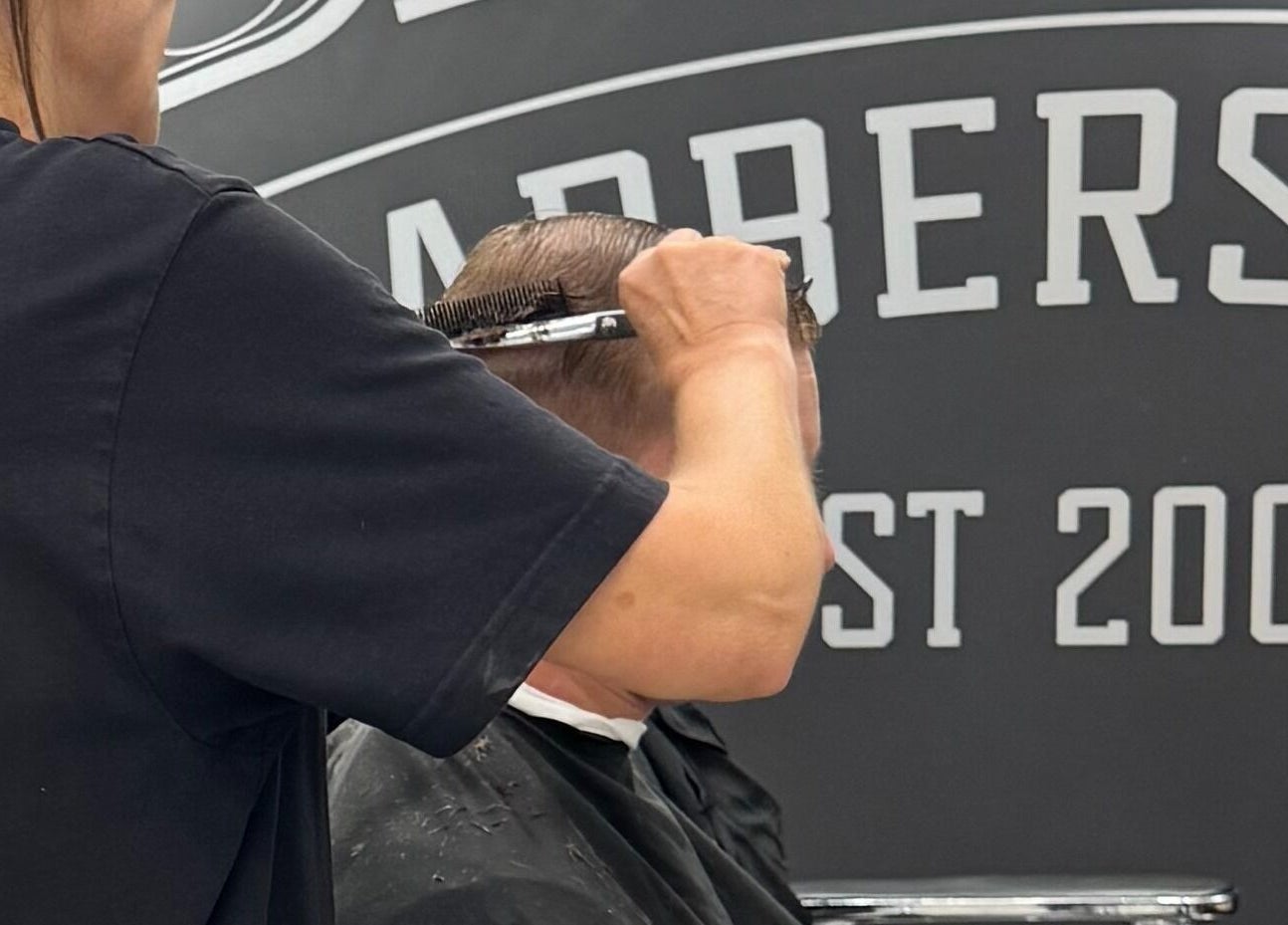 Stylist expertly cuts hair at Davilia Barbershop Karrinyup, Karrinyup, Western Australia, AU.