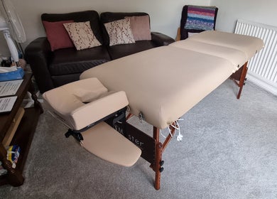 Comfortable massage table in cozy room at Thrive Therapy & Fitness, Peterborough, England, GB.