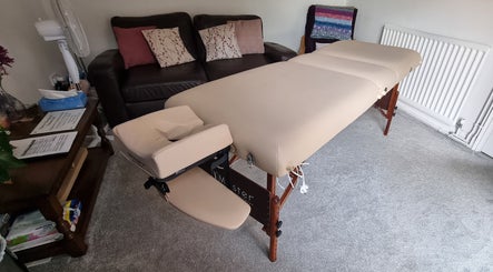 Comfortable massage table in cozy room at Thrive Therapy & Fitness, Peterborough, England, GB.