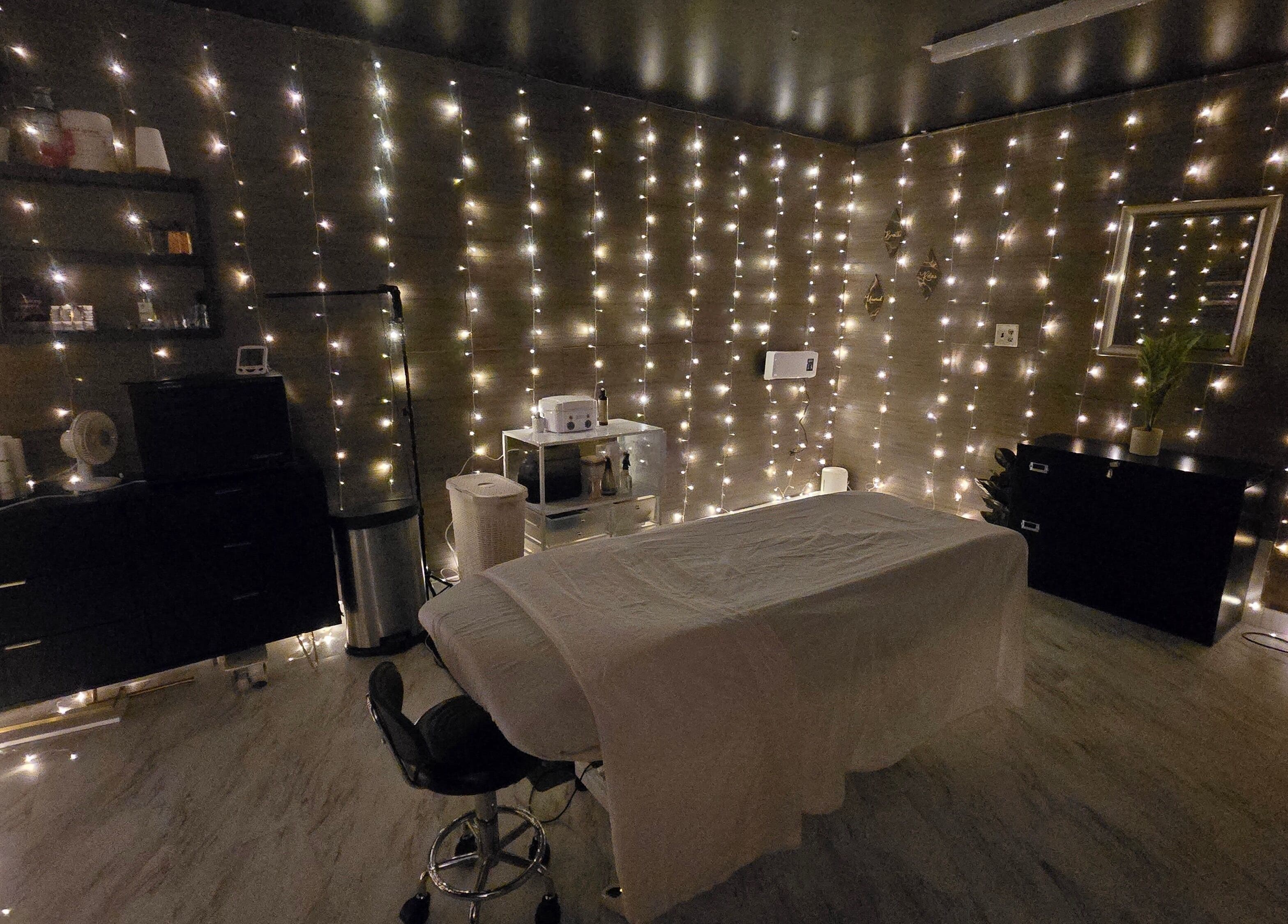 Cozy treatment room with soft lighting at Skin Deep Studio, Remus, Michigan, US.