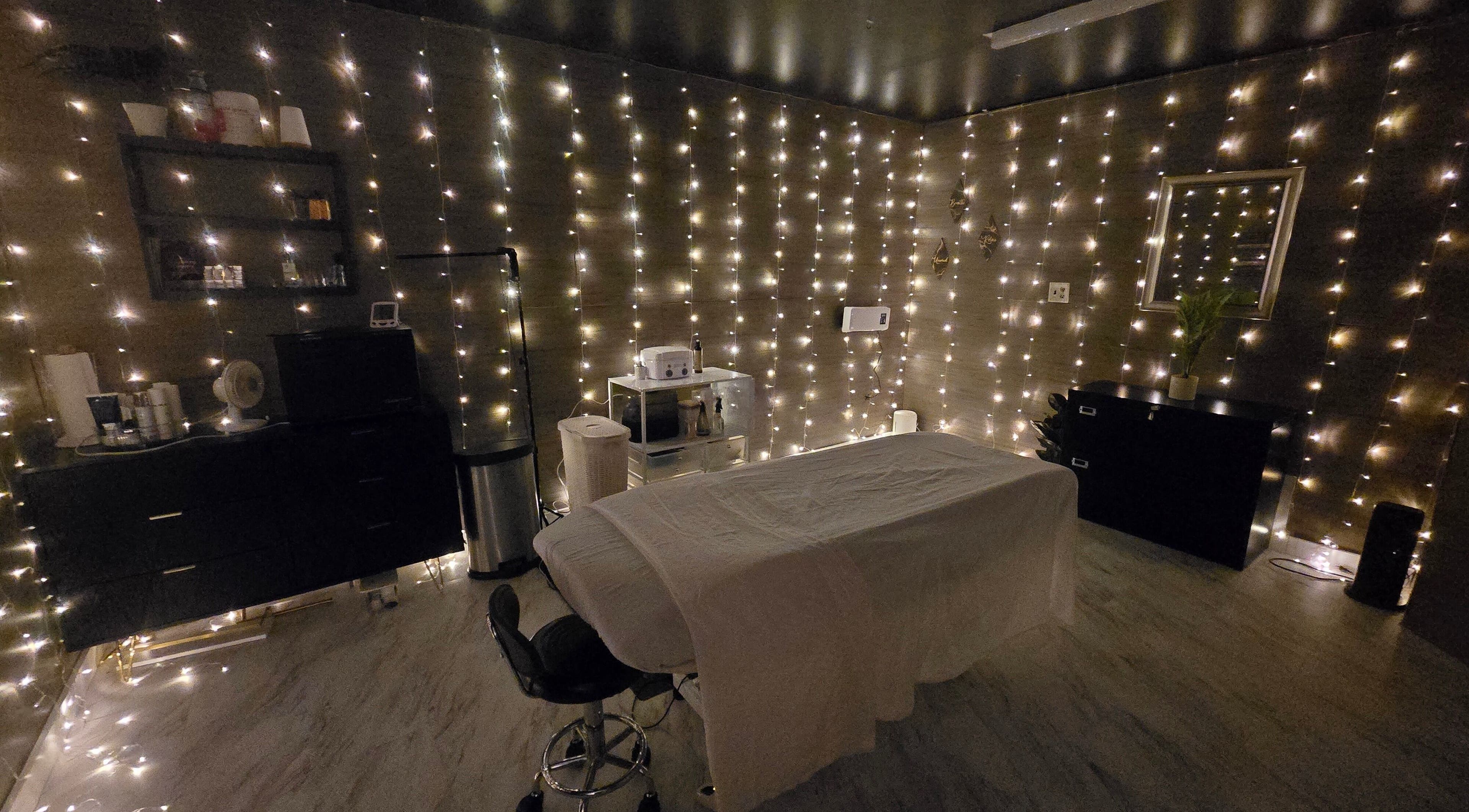 Cozy treatment room with soft lighting at Skin Deep Studio, Remus, Michigan, US.