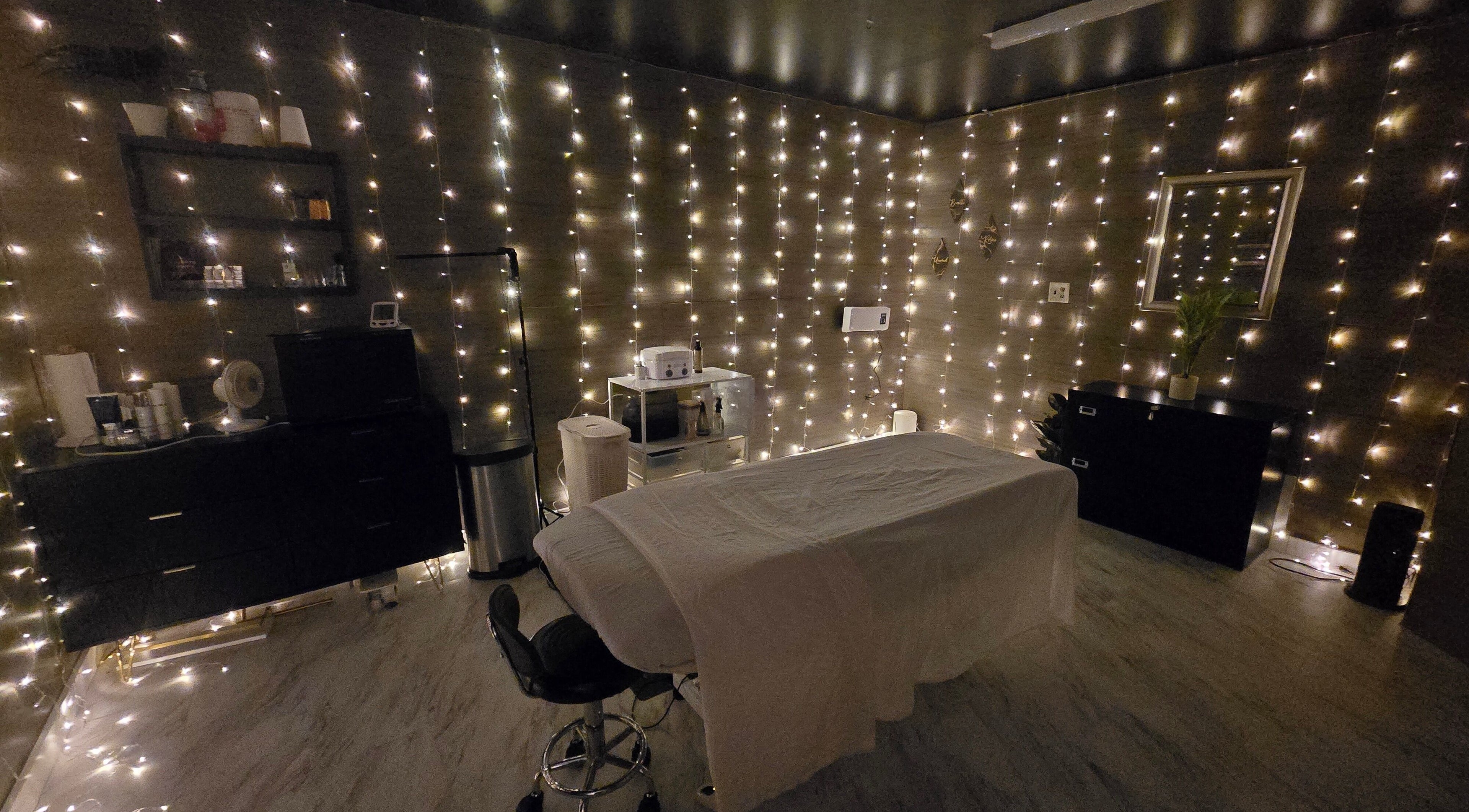 Cozy treatment room with soft lighting at Skin Deep Studio, Remus, Michigan, US.
