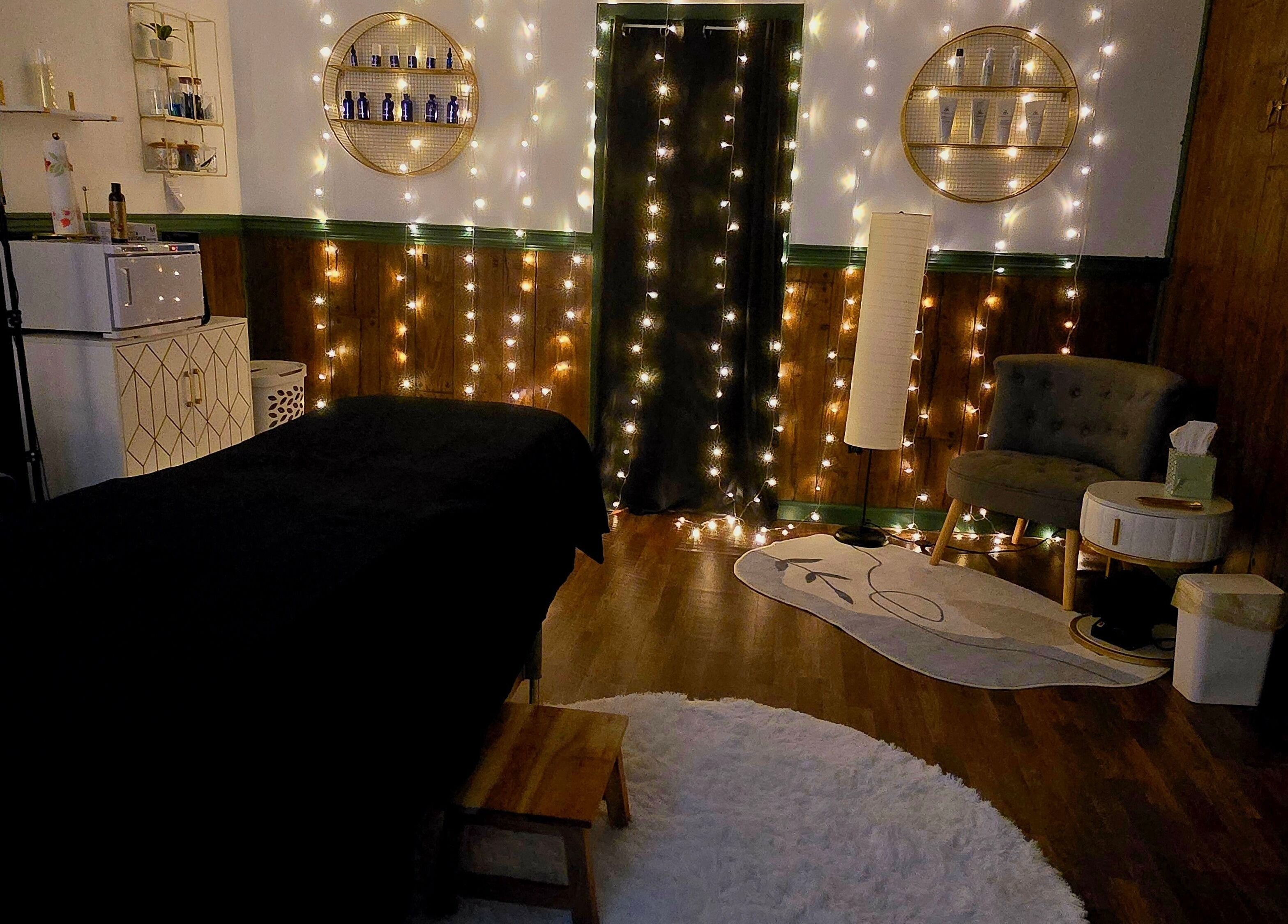 Elegant treatment room at Skin Deep Studio in Remus, Michigan, US, with warm lighting and modern decor.