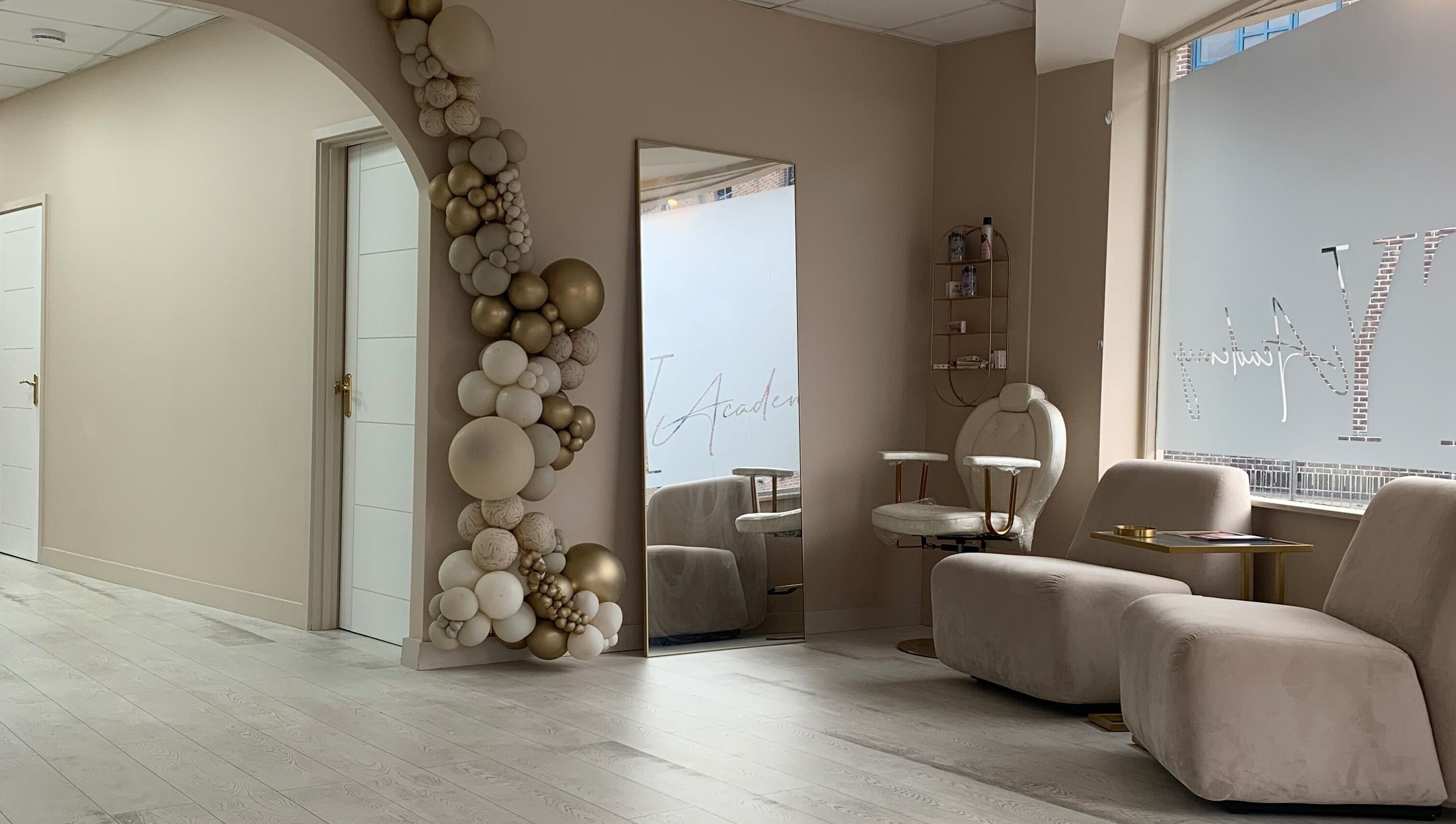 Chic waiting area at See You Laser, Havant, England, GB with plush seating and decorative arch.