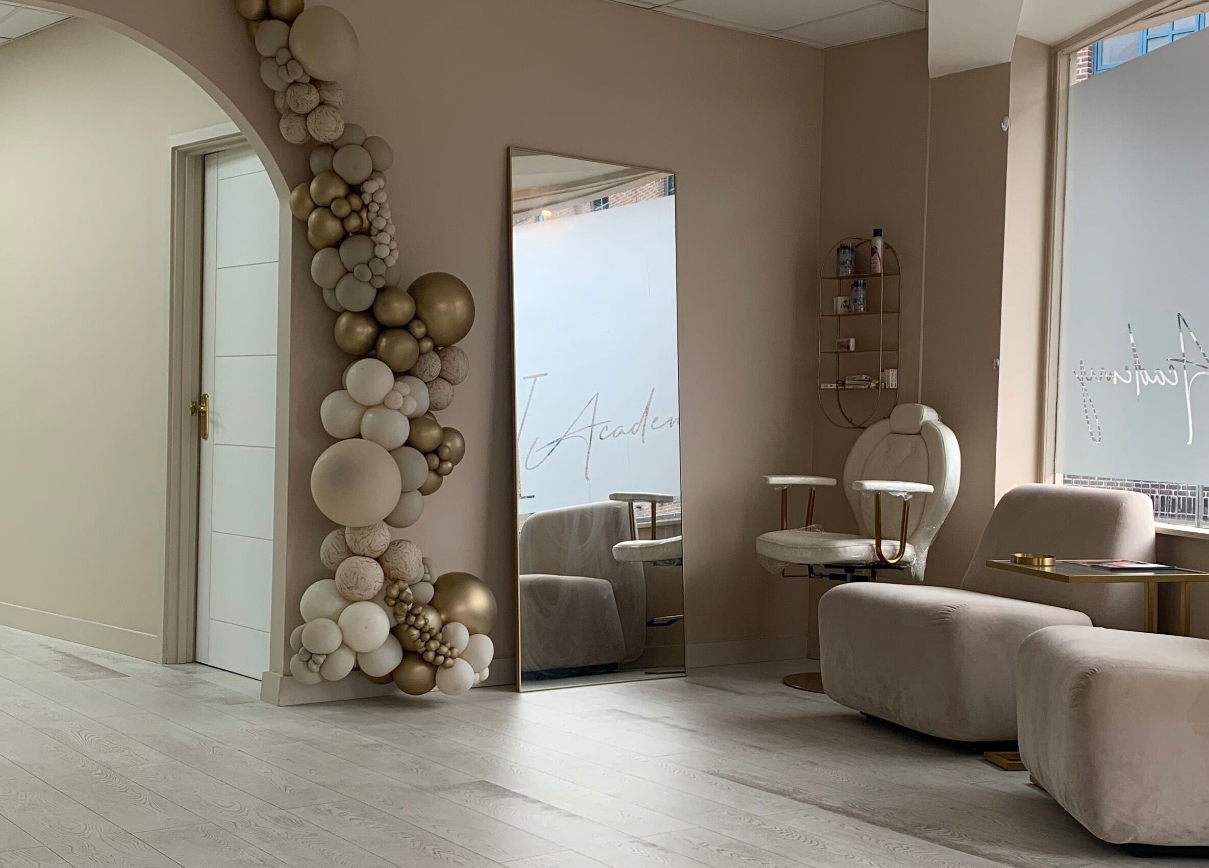 Chic waiting area at See You Laser, Havant, England, GB with plush seating and decorative arch.