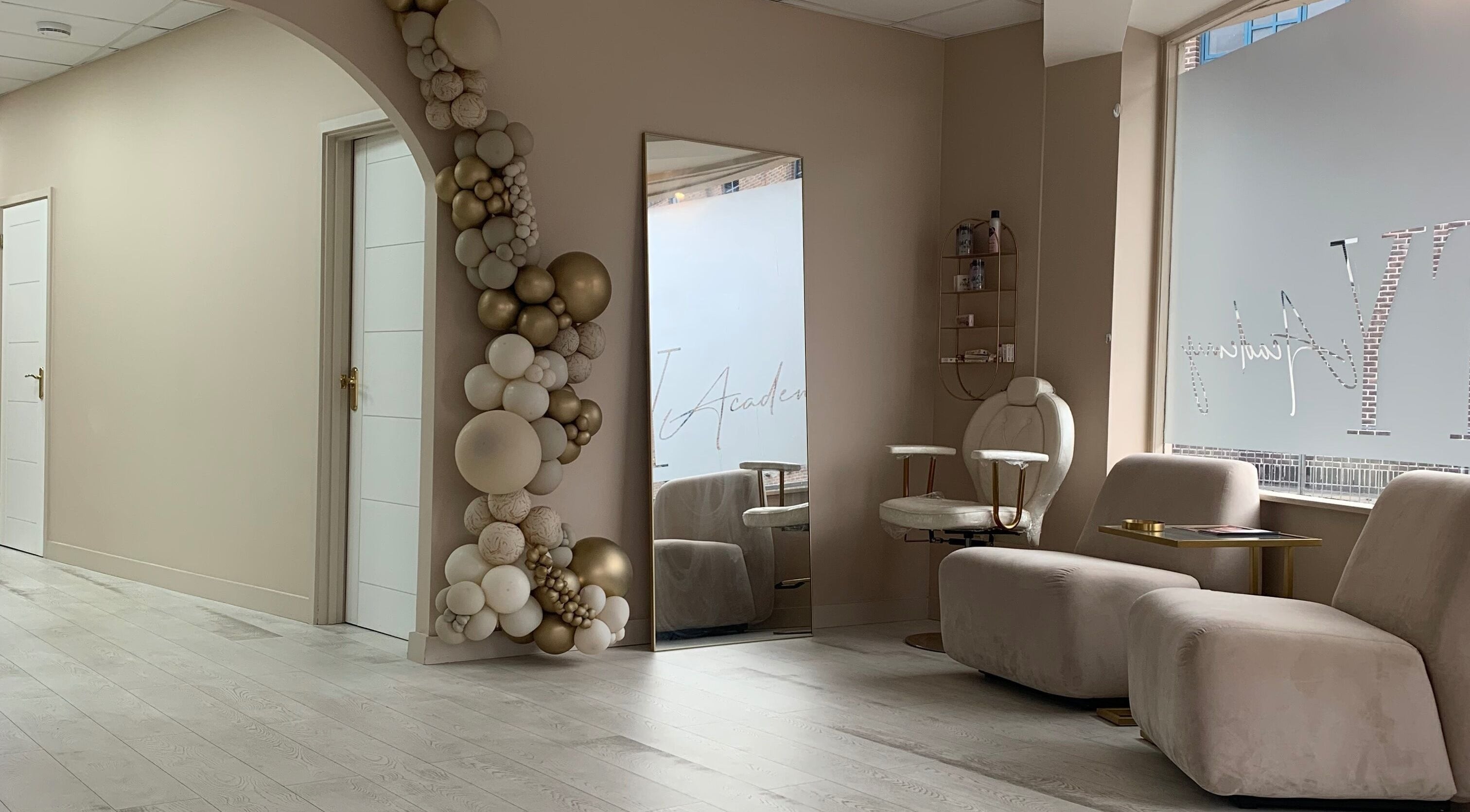 Chic waiting area at See You Laser, Havant, England, GB with plush seating and decorative arch.