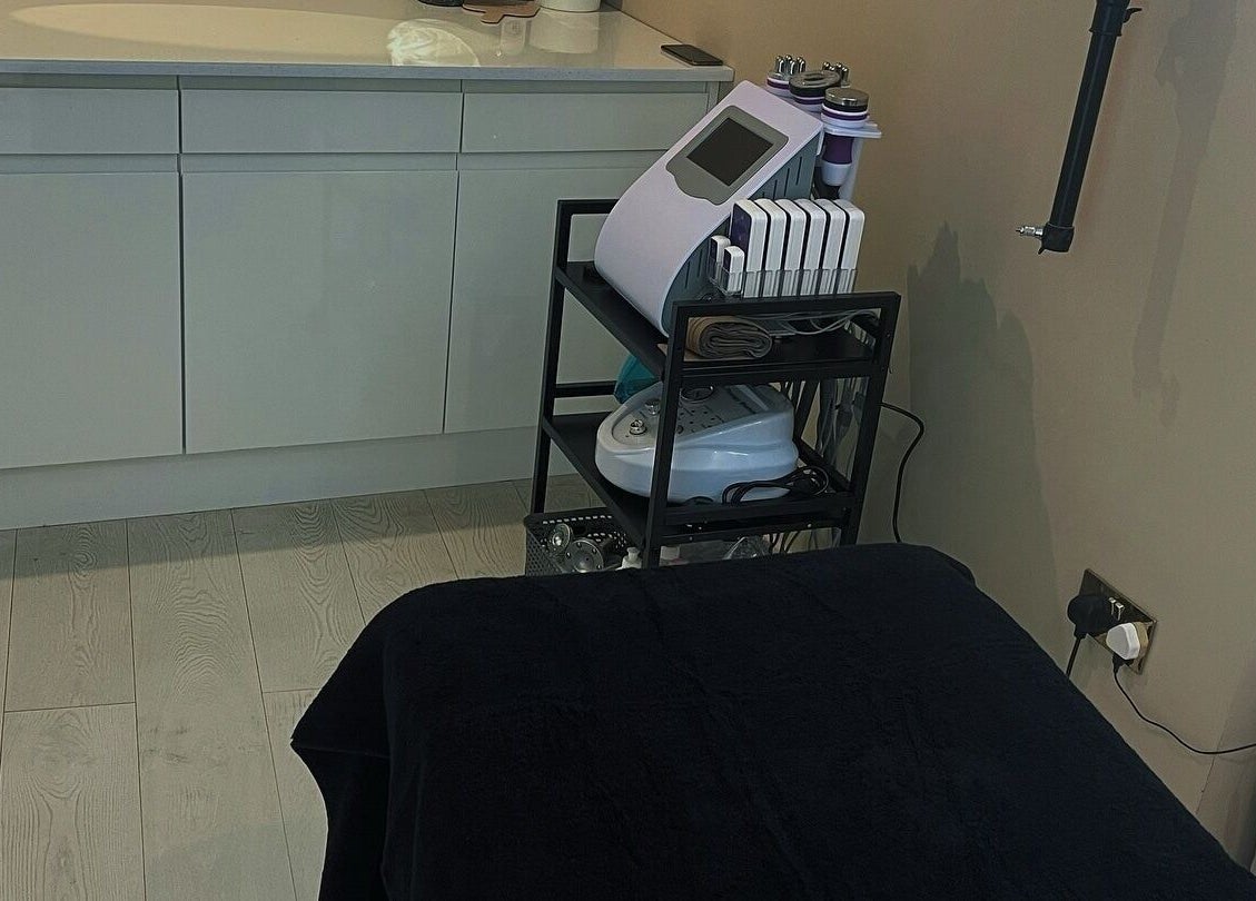 Cozy laser treatment room at See You Laser in Havant, England, GB featuring sleek equipment and calming decor.