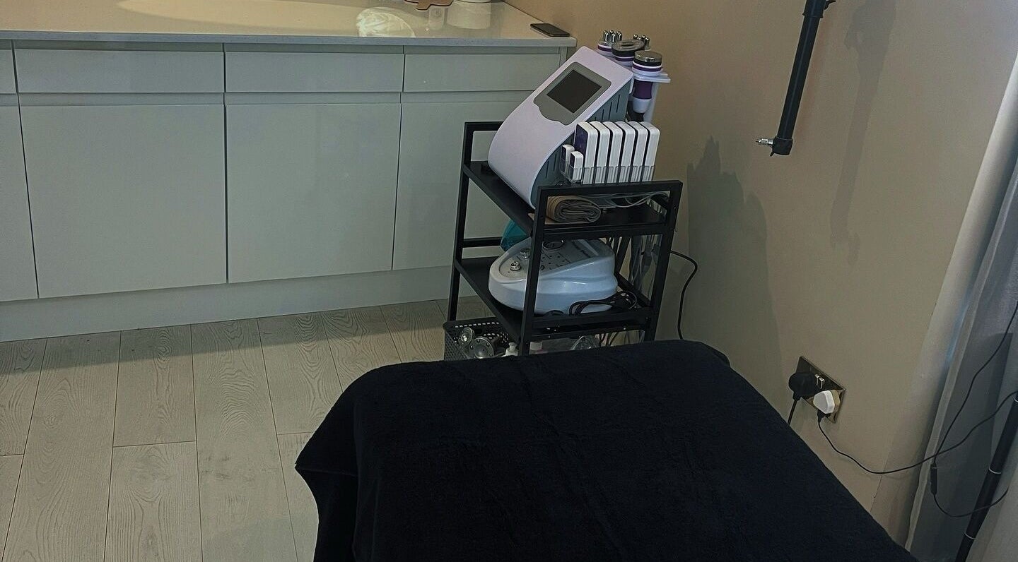Cozy laser treatment room at See You Laser in Havant, England, GB featuring sleek equipment and calming decor.