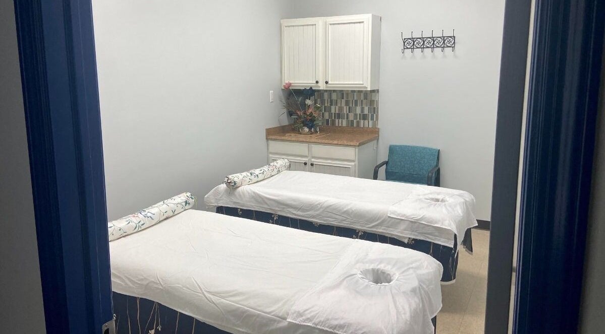 Relaxing massage room at Revive Asian Massage, Overland Park, Kansas, US with two massage tables.