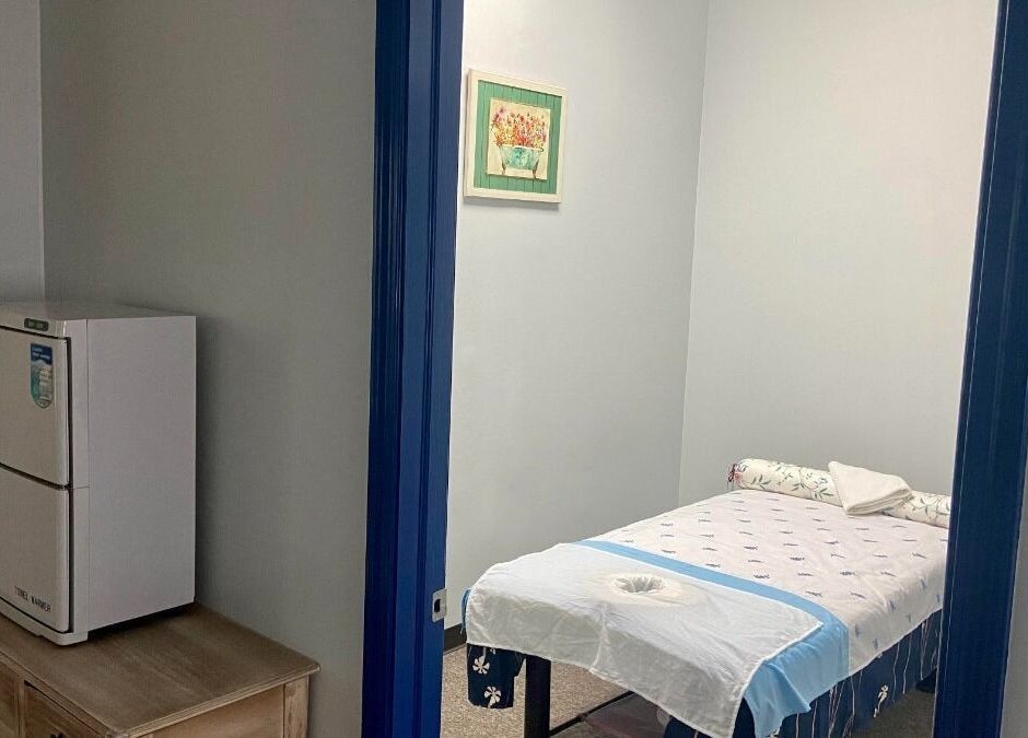 Relaxing massage room at Revive Asian Massage, Overland Park, Kansas, US, featuring a comfortable massage table.