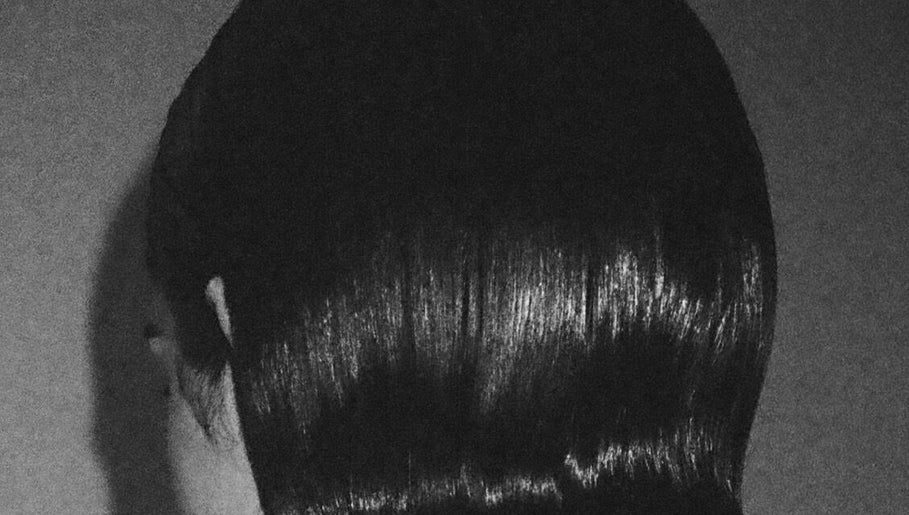 Sleek hairstyle at Chrissy Hutton Hair in London, England, GB, showcasing glossy, expertly crafted style.