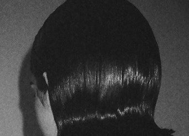 Sleek hairstyle at Chrissy Hutton Hair in London, England, GB, showcasing glossy, expertly crafted style.