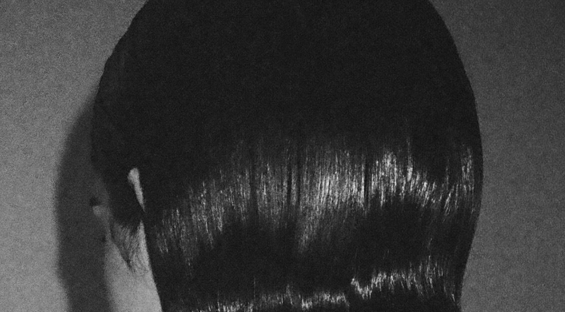 Sleek hairstyle at Chrissy Hutton Hair in London, England, GB, showcasing glossy, expertly crafted style.