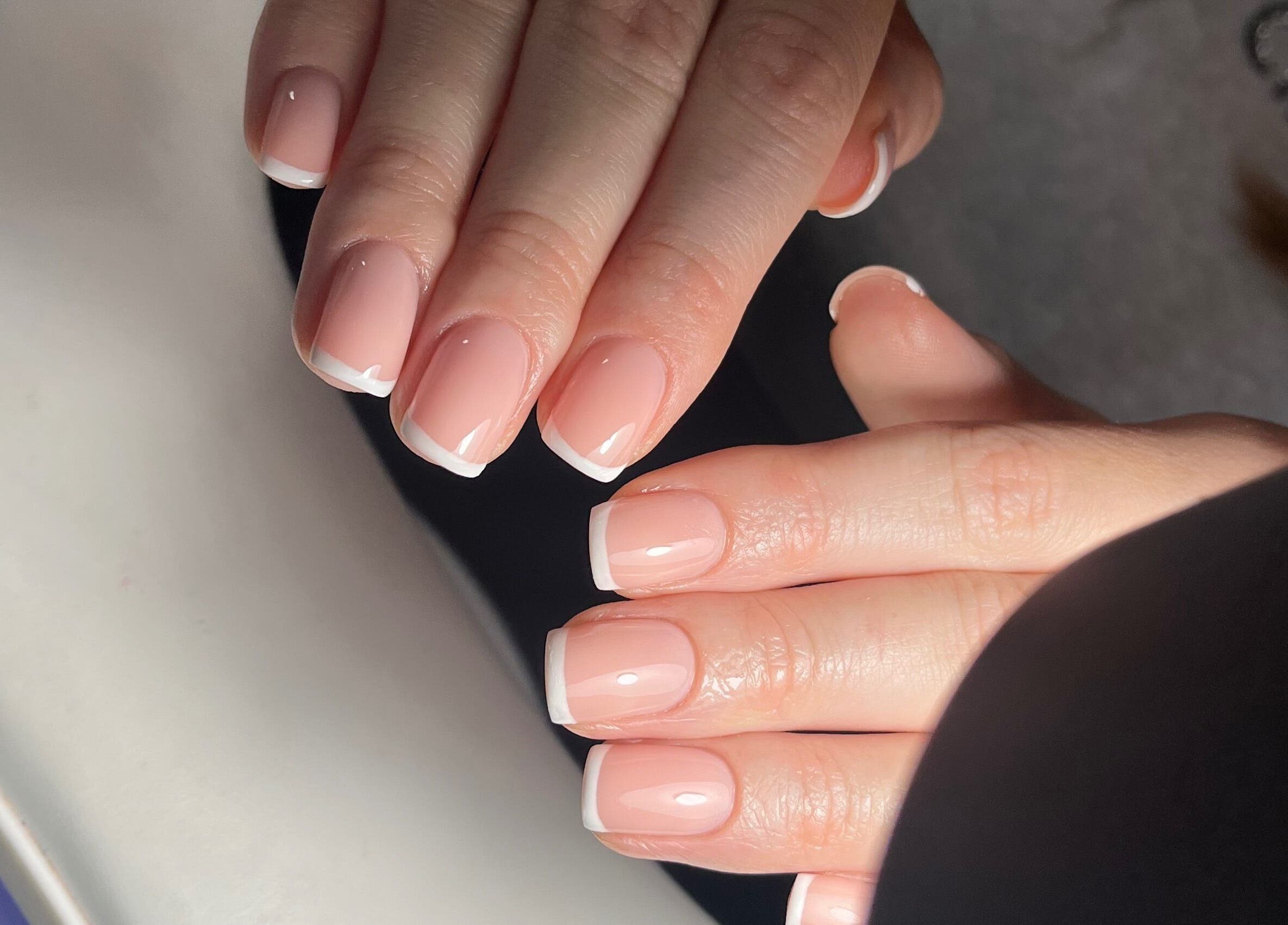 French manicure at Pooch 1 Creates, Bristol, England, GB. Polished nails with white tips.