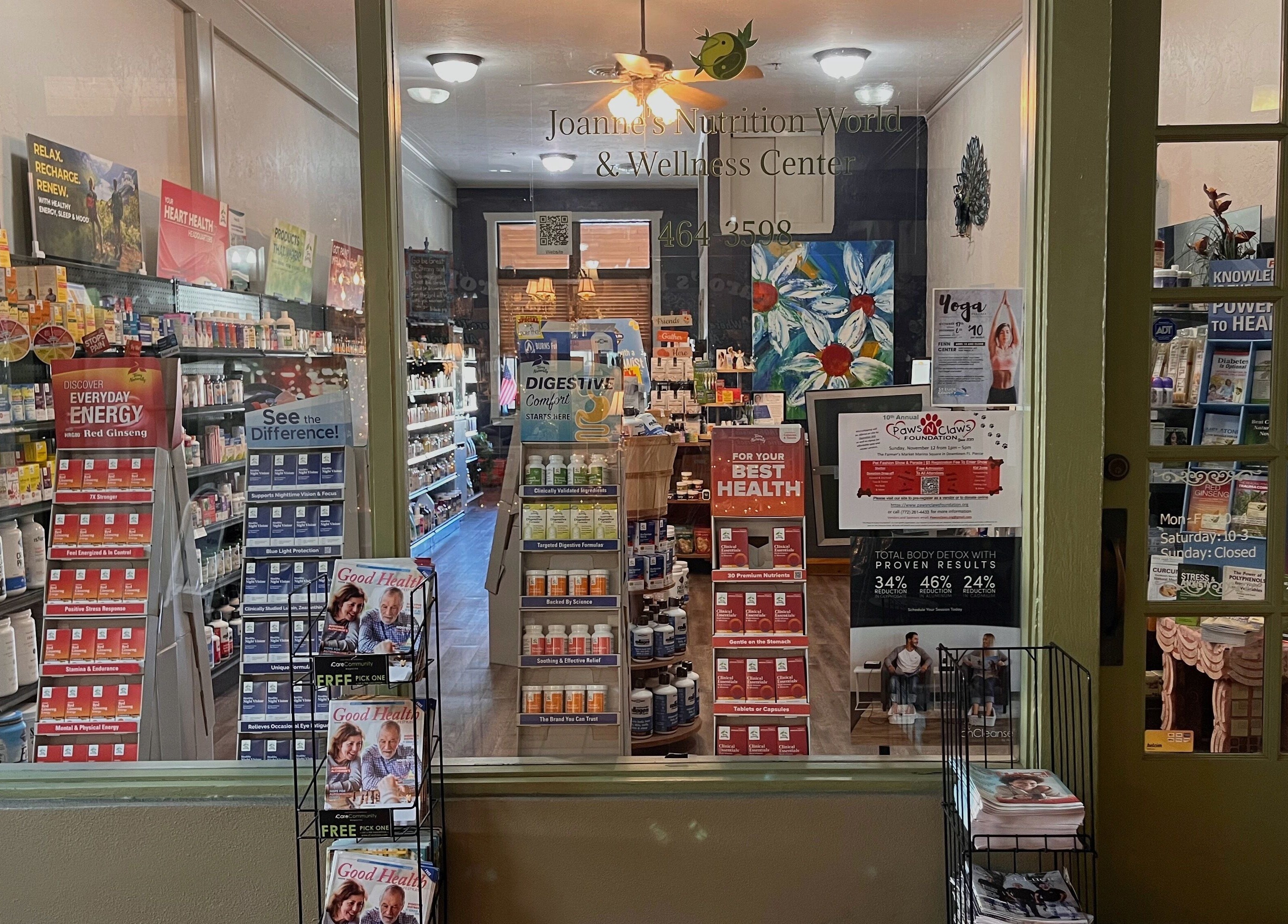 Front display of Joanne's Nutrition World, Fort Pierce, Florida showcasing health products and vibrant décor.