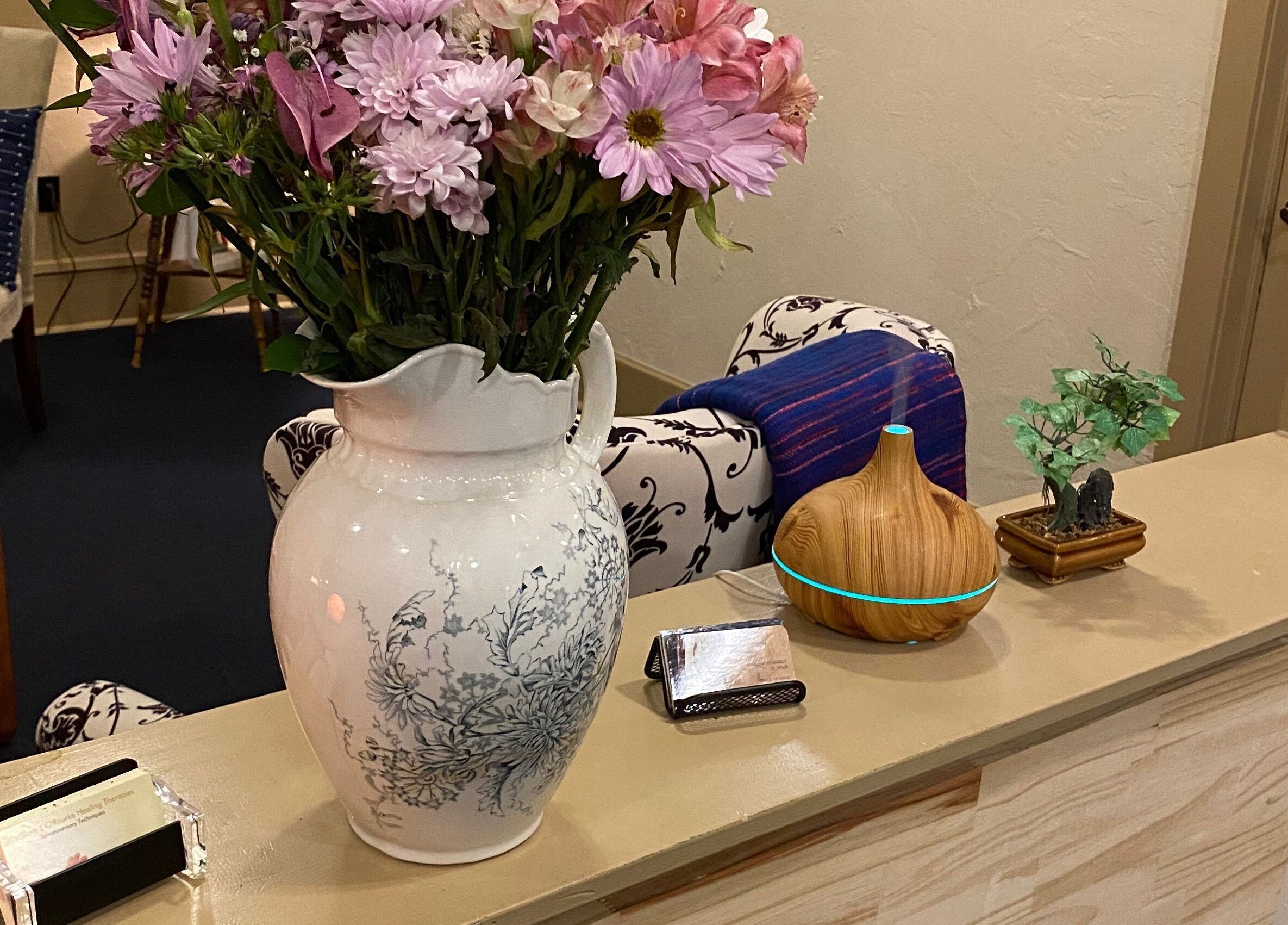 Flower vase on counter at Joanne's Nutrition World, Fort Pierce, Florida, US, enhancing the wellness ambiance.