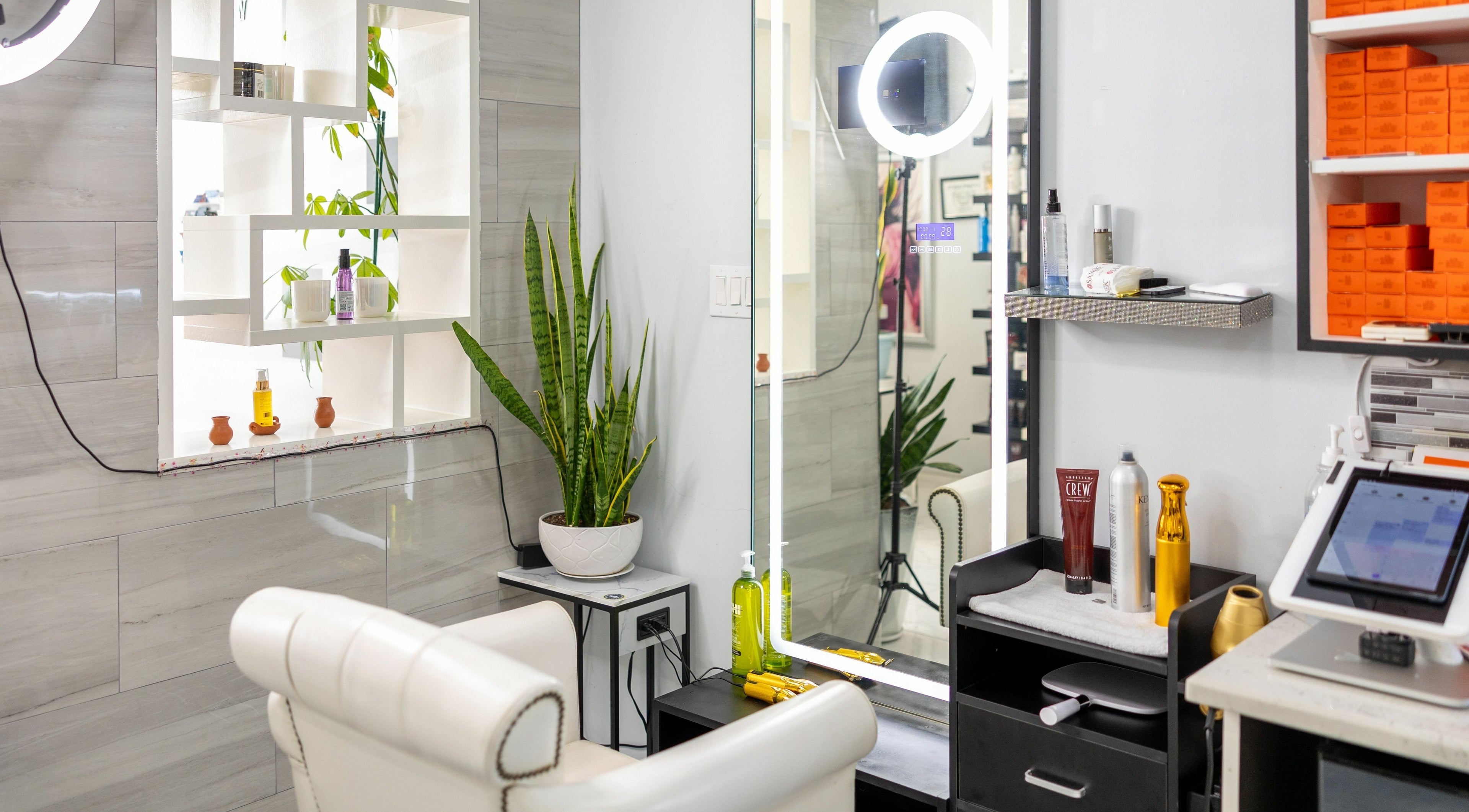 Stylish salon interior at Hair By Javier showing a cozy setup in Houston, Texas, US.