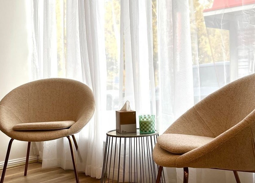 Chic waiting area with modern chairs at Charli James Hair and Co THE OAKS, The Oaks, New South Wales, AU.