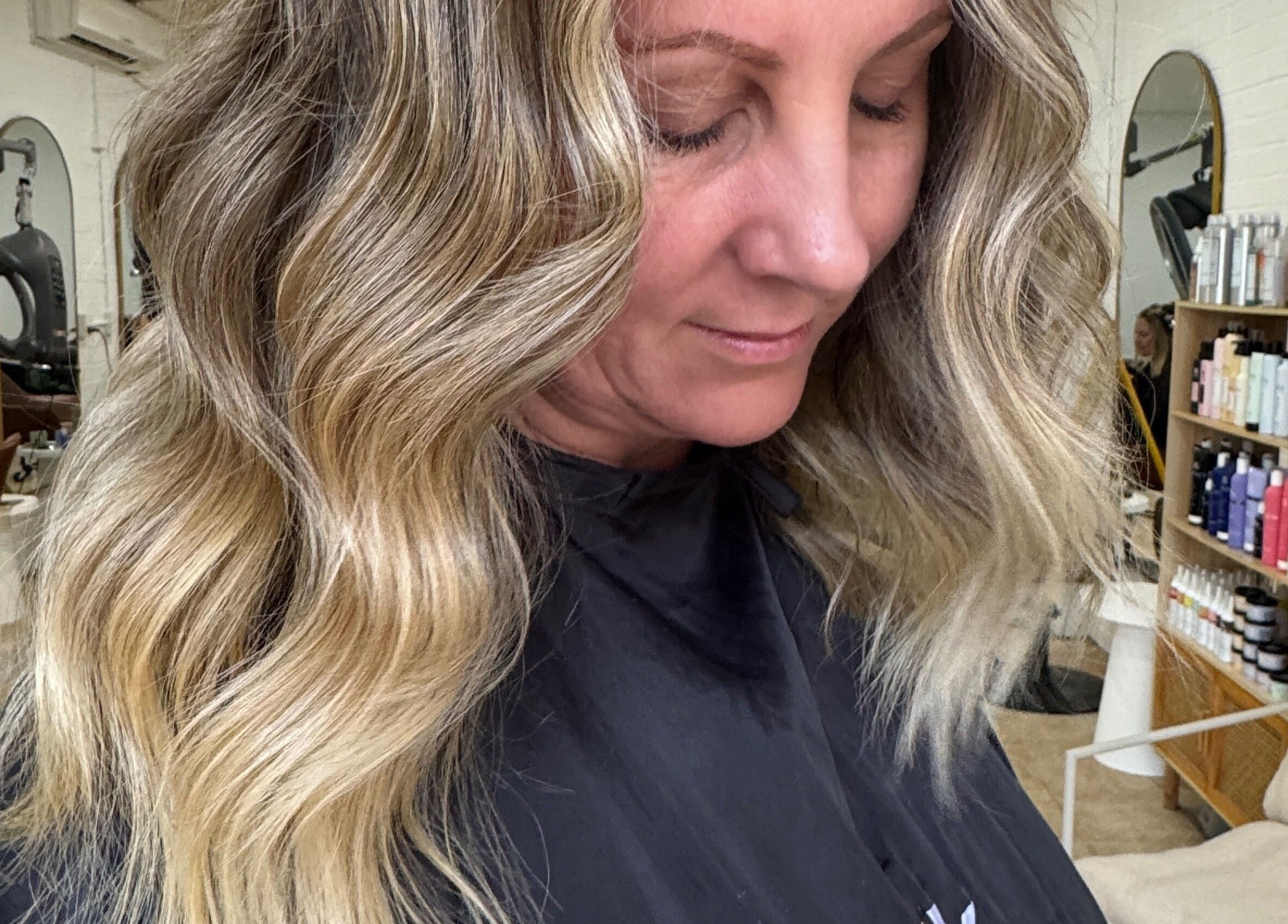 Woman with styled wavy hair at Charli James Hair and Co THE OAKS, The Oaks, New South Wales, AU.