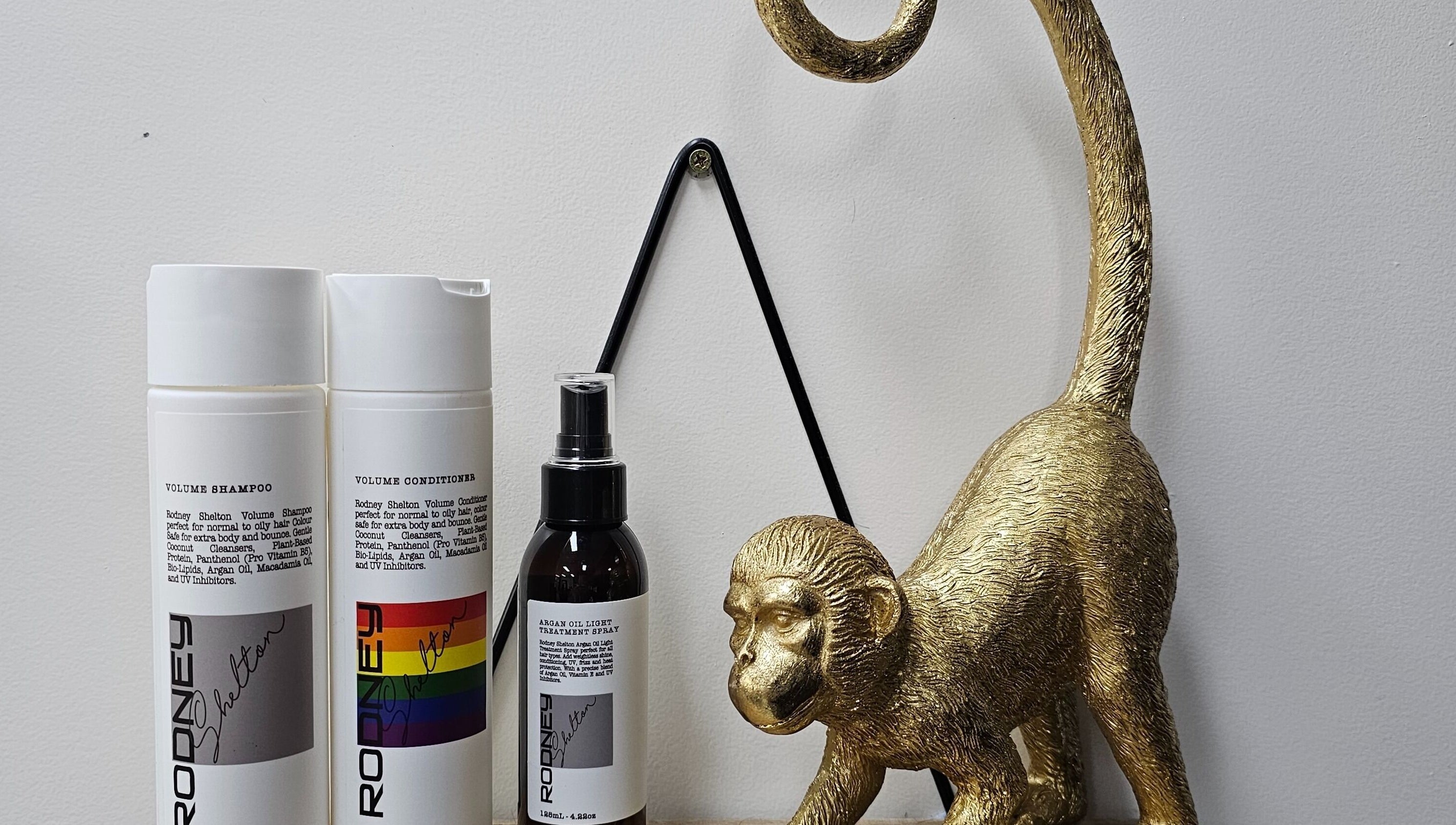 Elegant hair products and gold monkey statue at Queens on Queen Hair and Queens Hair Spa, Bundaberg, Queensland, AU.