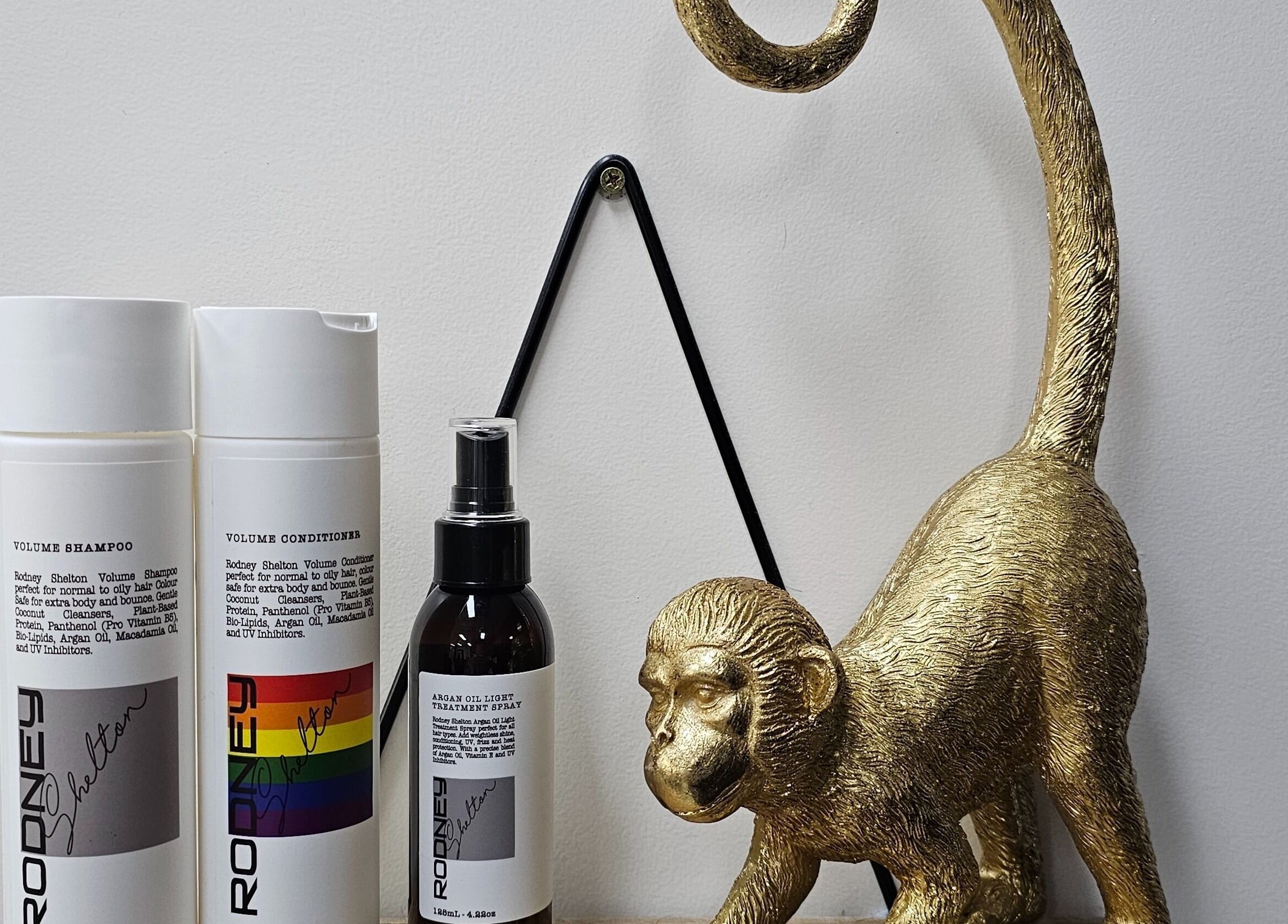 Elegant hair products and gold monkey statue at Queens on Queen Hair and Queens Hair Spa, Bundaberg, Queensland, AU.