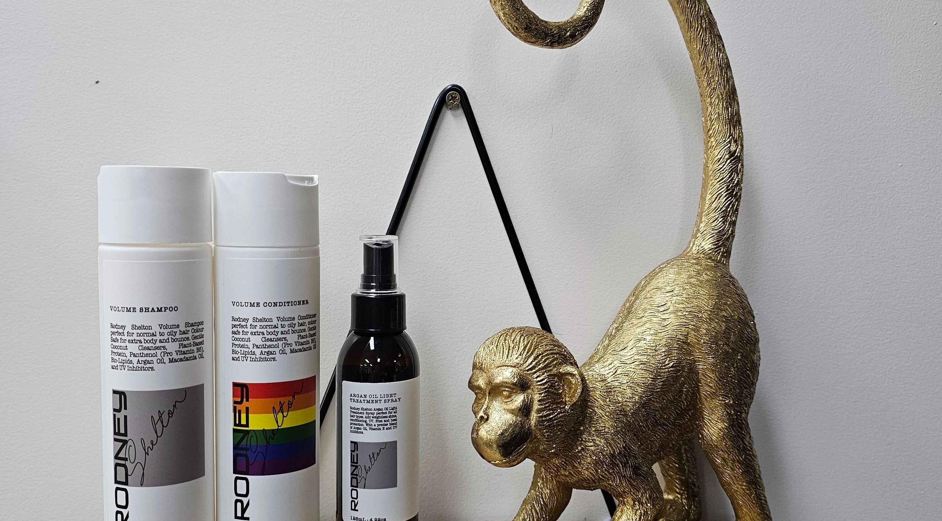 Elegant hair products and gold monkey statue at Queens on Queen Hair and Queens Hair Spa, Bundaberg, Queensland, AU.