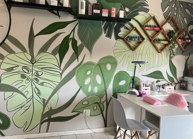 Stylish nail area at The A List Beauty Salon, Gqeberha, Eastern Cape, ZA with tropical wall art and chic decor.