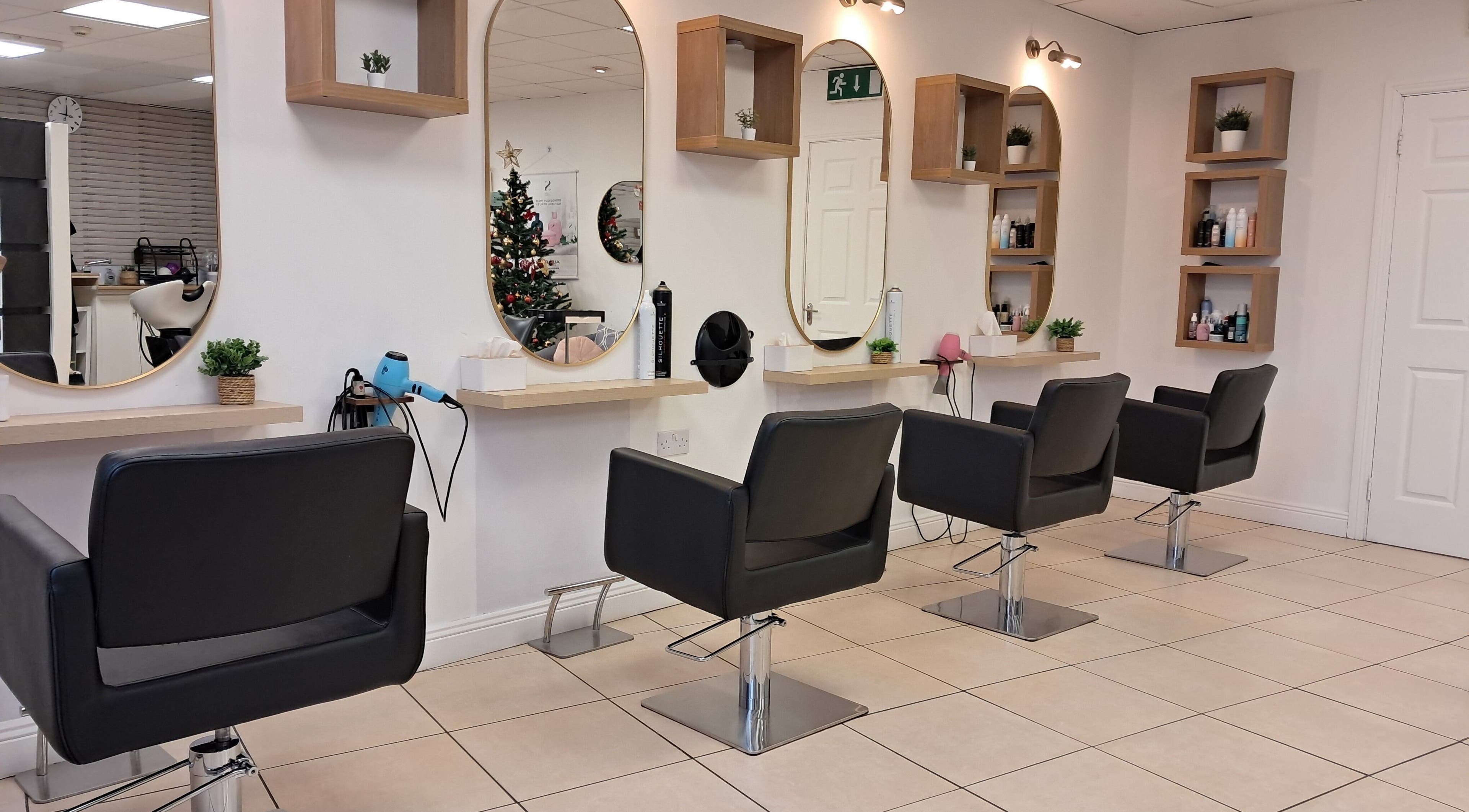 Modern salon interior at Bella Vida Hairstyling, Ballyragget, County Kilkenny, IE with sleek styling chairs.