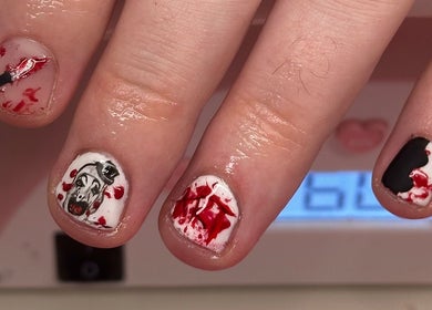Intricate nail art at Lanny King, High Melton, England, GB showcasing creative designs on fingertips.