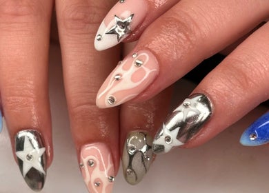 Intricate nail designs with stars and hues, showcased at Lanny King, High Melton, England, GB.